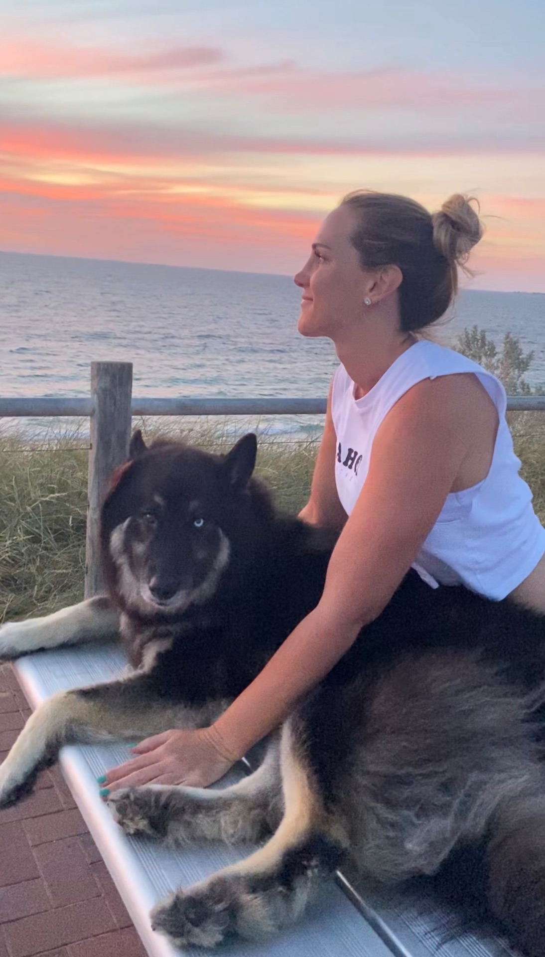 Watto and Skye watching the sunset over the ocean